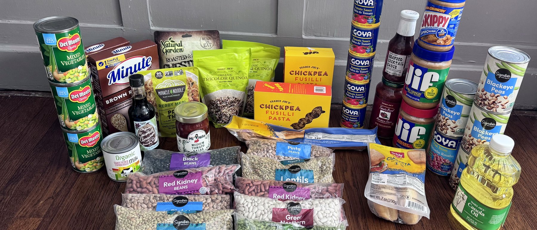 A wide spread of donated gluten-free canned goods, beans, pasta and pantry staples